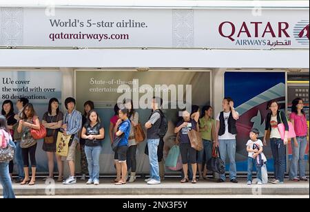 People waiting in Tramway stop.Des Voeux Road,Hong Kong, China Stock Photo