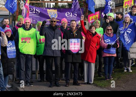 (front, left to right) Dr Patrick Roach general secretary of National Association of Schoolmasters Union of Women Teachers (NASUWT), NASUWT National Official for Scotland Mike Corbett, and Scottish Trades Union Congress (STUC) general secretary Roz Foyer, with teachers on the picket line outside St. Andrew's RC Secondary School, in Glasgow, as they take strike action in a dispute over pay. Picture date: Wednesday March 1, 2023. Stock Photo