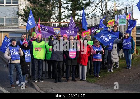 (front, left to right) Dr Patrick Roach general secretary of National Association of Schoolmasters Union of Women Teachers (NASUWT), NASUWT National Official for Scotland Mike Corbett, and Scottish Trades Union Congress (STUC) general secretary Roz Foyer, with teachers on the picket line outside St. Andrew's RC Secondary School, in Glasgow, as they take strike action in a dispute over pay. Picture date: Wednesday March 1, 2023. Stock Photo