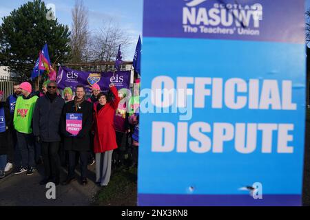 (front, left to right) Dr Patrick Roach, general secretary of National Association of Schoolmasters Union of Women Teachers (NASUWT), NASUWT Official for Scotland Mike Corbett, and Scottish Trades Union Congress (STUC) general secretary, Roz Foyer, with teachers on the picket line outside St. Andrew's RC Secondary School, in Glasgow, as they take strike action in a dispute over pay. Picture date: Wednesday March 1, 2023. Stock Photo