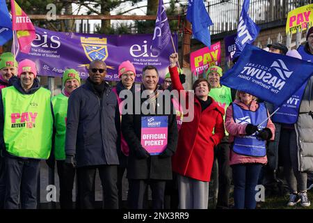 (front, left to right) Dr Patrick Roach general secretary of National Association of Schoolmasters Union of Women Teachers (NASUWT), NASUWT Official for Scotland Mike Corbett, and Scottish Trades Union Congress (STUC) general secretary Roz Foyer, with teachers on the picket line outside St. Andrew's RC Secondary School, in Glasgow, as they take strike action in a dispute over pay. Picture date: Wednesday March 1, 2023. Stock Photo