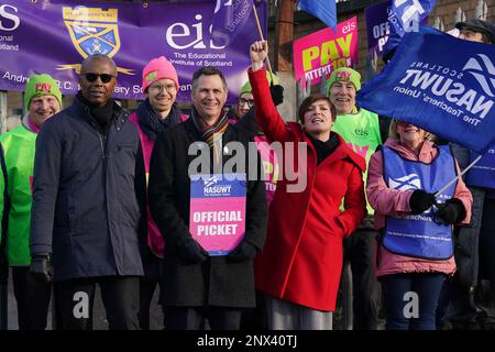 (front, left to right) Dr Patrick Roach general secretary of National Association of Schoolmasters Union of Women Teachers (NASUWT), NASUWT Official for Scotland Mike Corbett, and Scottish Trades Union Congress (STUC) general secretary Roz Foyer, with teachers on the picket line outside St. Andrew's RC Secondary School, in Glasgow, as they take strike action in a dispute over pay. Picture date: Wednesday March 1, 2023. Stock Photo