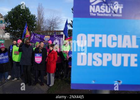 (front, left to right) Dr Patrick Roach, general secretary of National Association of Schoolmasters Union of Women Teachers (NASUWT), NASUWT Official for Scotland Mike Corbett, and Scottish Trades Union Congress (STUC) general secretary Roz Foyer, with teachers on the picket line outside St. Andrew's RC Secondary School, in Glasgow, as they take strike action in a dispute over pay. Picture date: Wednesday March 1, 2023. Stock Photo