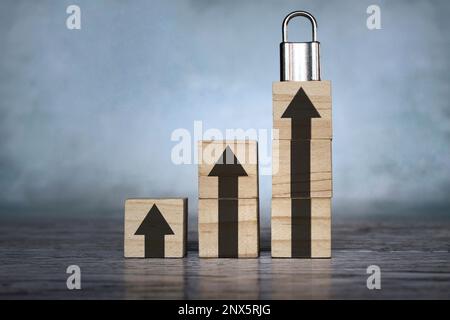 Padlock and upward arrow. Upgrade protection, enhanced protection concept Stock Photo