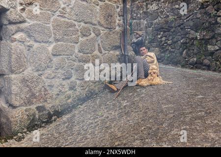 Montalegre, Portugal. 19th Feb, 2023. A careto of Misarela is seen resting without his mask. Entrudo da Misarela is a socio-cultural dynamization project that aims to bring the two banks of Rabagão closer together, around the same idea: to recreate Entrudo as a celebration of the 'entrance' of Spring. The event happens in the Misarela bridge, a bridge that was built in the middle ages, located in Montalegre in the North East of Portugal. (Photo by Telmo Pinto/SOPA Images/Sipa USA) Credit: Sipa USA/Alamy Live News Stock Photo