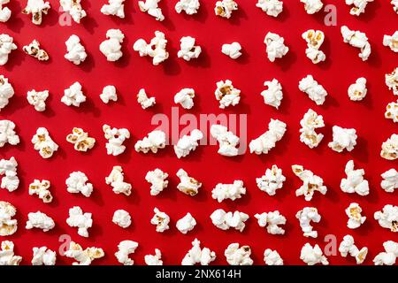 Popcorn pattern on red background Stock Photo