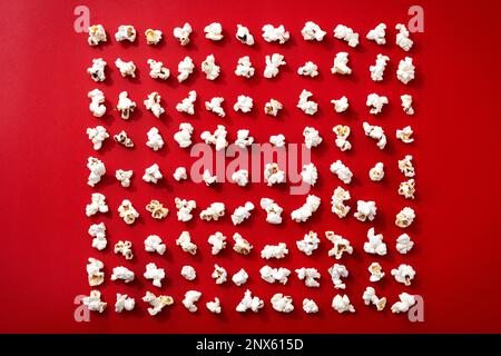 Popcorn pattern on red background Stock Photo
