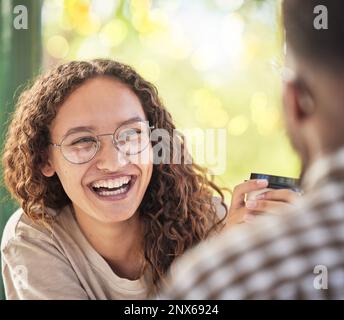 Face, happy or date and a black woman drinking coffee in the park with her boyfriend during summer. Smile, love and dating with a young female smiling Stock Photo