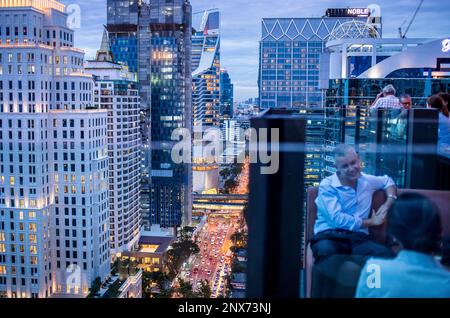 View from Char Rooftop Bar at Indigo Hotel, Skyline and Wireless Road at night, downtown, Bangkok, Thailand Stock Photo