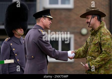 The Prince of Wales, Colonel of the Welsh Guards, meeting troops from the 5th Royal Australian Regiment (5RAR), who are currently in the UK helping to train the Ukrainian Armed Forces, during a visit to the 1st Battalion Welsh Guards at Combermere Barracks in Windsor, Berkshire. Picture date: Wednesday March 1, 2023. Stock Photo