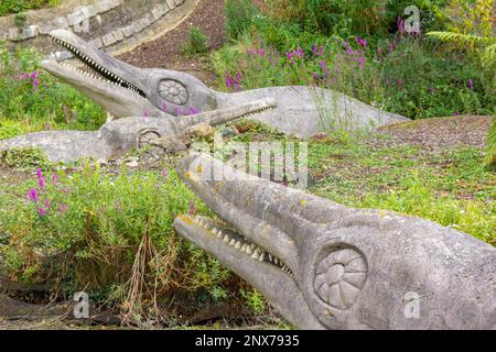 Ichthyosaurus dinosaur models at Crystal Palace Park. The first dinosaur sculptures in the world. Extensively restored in 2002, and Grade 1 Listed. Stock Photo
