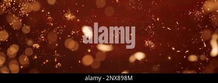 festive abstract red background with yellow glitter particles Stock Photo