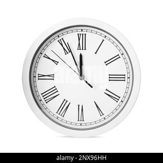 Clock showing five minutes until midnight isolated on white. New Year countdown Stock Photo