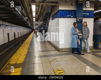 Passengers wait for a train at the Canal Street station on the New York subway on Saturday. February 18, 2023. (© Richard B. Levine) Stock Photo