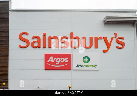Slough, Berkshire, UK. 1st March, 2023. A Sainsbury's supermarket with an Argos store in Slough, Berkshire. Sainsbury's are reported to be planning on closing two Argos depots over the next three years in a bid to cut costs. The closures are expected to impact upon more than 1,400 jobs. The plan is close the Argos warehouse in Basildon, Essex, and a depot in Heywood, Greater Manchester by 2026. Credit: Maureen McLean/Alamy Live News Stock Photo