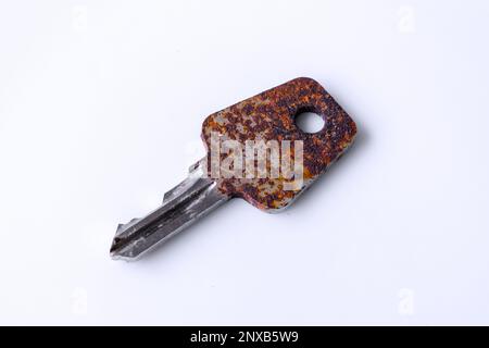 Rusty key on white background Stock Photo