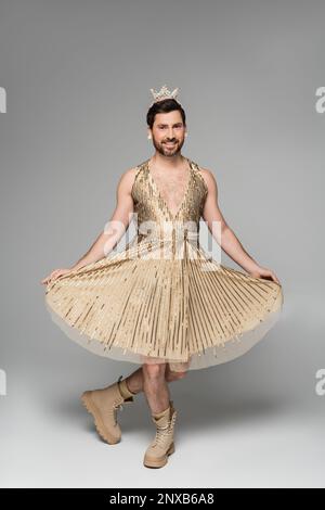full length of bearded man with toy crown on head and princess dress costume smiling while posing on grey,stock image Stock Photo - Alamy full length of bearded man with toy crown on head and princess dress costume smiling while posing on grey,stock image Stock Photo - Alamy