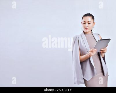Portrait of a smart businesswoman holding a digital tablet Stock Photo
