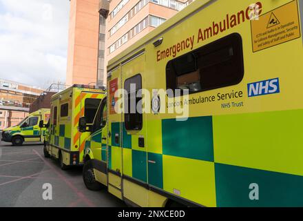 London, UK, 27 February 2023: Emergency ambulances parked outside the accident and Emergency admissions bay at St George's Hospital in Tooting, south London. Anna Watson/Alamy Stock Photo