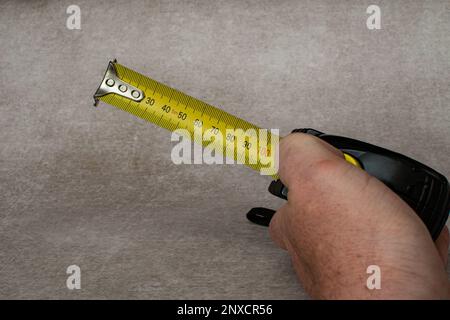 Self retracting metric measuring tape Stock Photo