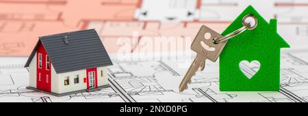 model home and house key with architectural plan Stock Photo