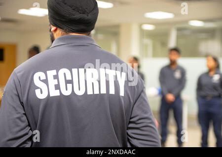 Fire Alarm training class by security guard in office Stock Photo