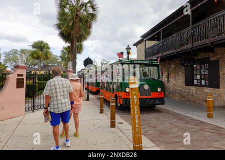 People riding the Old Town Trolley through the historic streets of St. Augustine, Florida, USA. Stock Photo