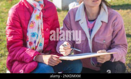 Sketchbook and paints - student in the process of painting a face Stock  Photo - Alamy