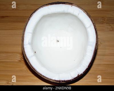 Coconut on a wooden background Stock Photo