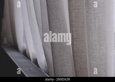 White linen curtain heating metal radiator background Stock Photo