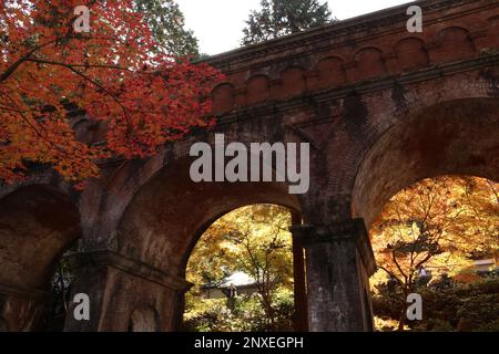 Autumn leaves and Suirokaku (ruins of an old aqueduct) in Nanzenji temple, Kyoto, Japan Stock Photo