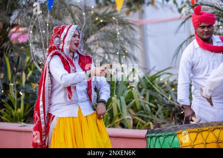 noida haat india portrait on unidentified male artist performing folk dance of haryana in colorful ethnic dress with smile and expressions