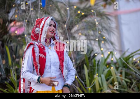 Noida Haat, India: Portrait on unidentified male artist performing folk dance of haryana in colorful ethnic dress with smile and expressions. Stock Photo