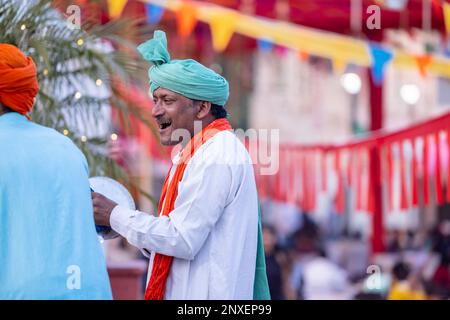 noida haat india portrait on unidentified male artist performing folk dance of haryana in colorful ethnic dress with smile and expressions