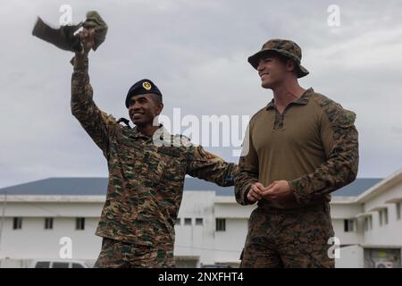 NAVAL BASE HERA, TIMOR-LESTE (Feb. 13, 2023) – Timor-Leste Corpo De Fuzileiros 1st Lt. Mario Araujo, left, executive officer, holds up his gift during Cooperation Afloat Readiness and Training/Marine Exercise Timor-Leste, Feb, 13. CARAT/MAREX Timor-Leste is a bilateral exercise between Timor-Leste and the United States designed to promote regional security cooperation, maintain and strengthen maritime partnerships, and enhance maritime interoperability. In its 28th year, the CARAT series is comprised of multinational exercises, designed to enhance U.S. and partner forces’ abilities to operate Stock Photo