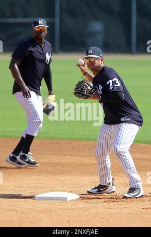 TAMPA, FL - MAR 01: Russell Wilson (73) makes the throw over to first base  to complete the double play during the New York Yankees spring training  workout on March 01, 2018