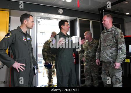 From left: U.S. Air Force Col. Christopher Clark, commander,144th Fighter Wing, California National Guard, and Lt. Gen. Michael Loh, director,Air National Guard, speak with Technical Sgt. Matthew Steht, a crew chief with the 144th Aircraft Maintenance Squadron, about the adaptive basing trailer Feb. 4, 2023, at the Fresno Air National Guard Base, California. In addition to viewing the trailer, Loh also toured  the maintenance, operations, and mission support sections during his visit. Stock Photo