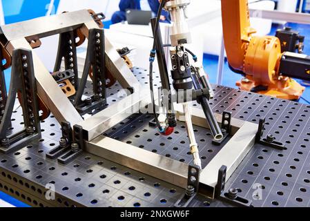 Robot arm for automatic metal welding Stock Photo