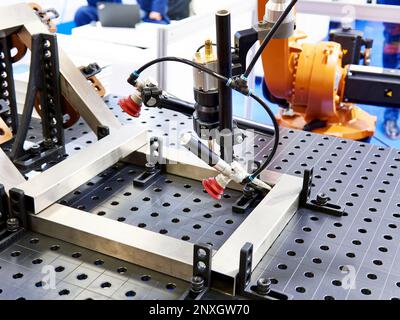 Robot arm for automatic metal welding Stock Photo