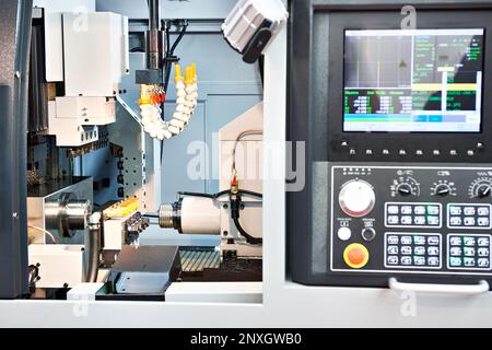 Automatic Lathe CNC with longitudinal turning Stock Photo