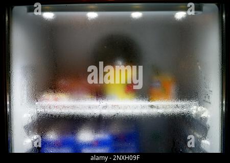 Close-up of water droplets on the glass of the refrigerator. Condensation conditions of the water in the air, forming a blurry water droplets. Stock Photo