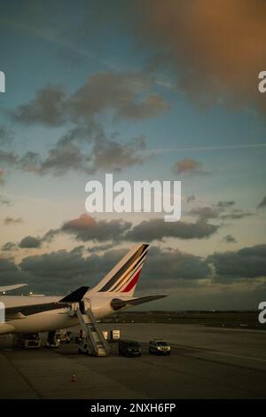 A plane standing on the runway of Charles de Gaulle Airport, ready for takeoff Stock Photo