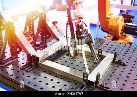 Robot arm for automatic metal welding Stock Photo