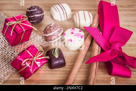 Chocolate pralines truffles for Valentines Day in pink color. Stock Photo
