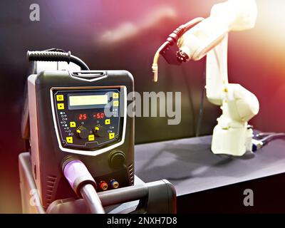 Modern welding machine inverter and robot manipulator Stock Photo