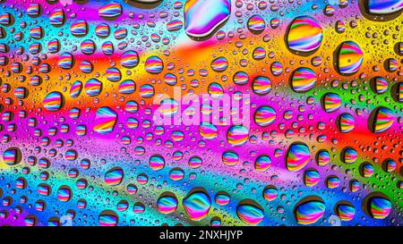 Water drops over a colorful abstract background Stock Photo