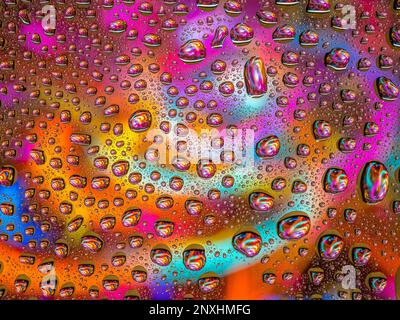 Water drops over a colorful abstract background Stock Photo