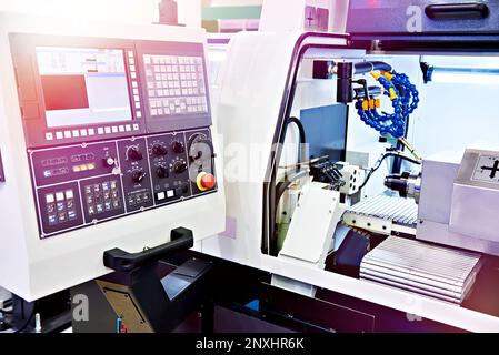 Automatic Lathe CNC longitudinal turning with control panel Stock Photo