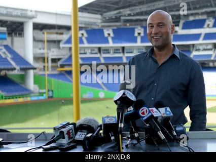 Miami Marlins baseball team CEO Derek Jeter, center, speaks to members of  the media inside Marlins Park stadium, Monday, Feb. 11, 2019, in Miami.  Jeter is entering his second season as CEO