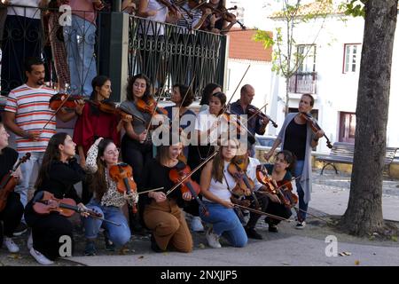 Lisbon, Portugal- October 20, 2022: Group of young people playing the violin in Lisbon Stock Photo